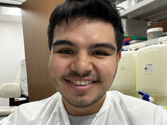 Lester Berrios Cortes in a lab coat.