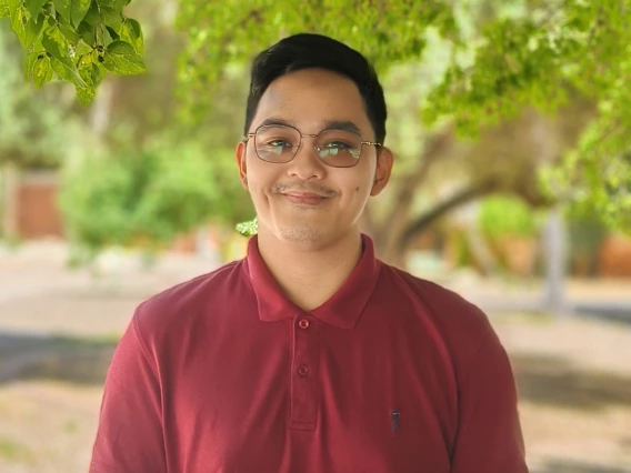 Image of Jarvin Nipales in front of some trees