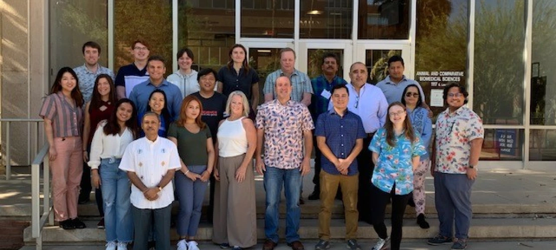 Image of short course participants and staff on the steps of the ACBS building