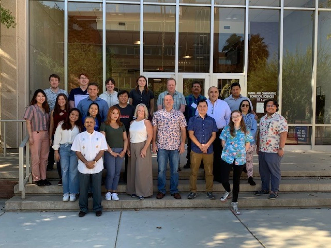 Image of short course participants and staff on the steps of the ACBS building