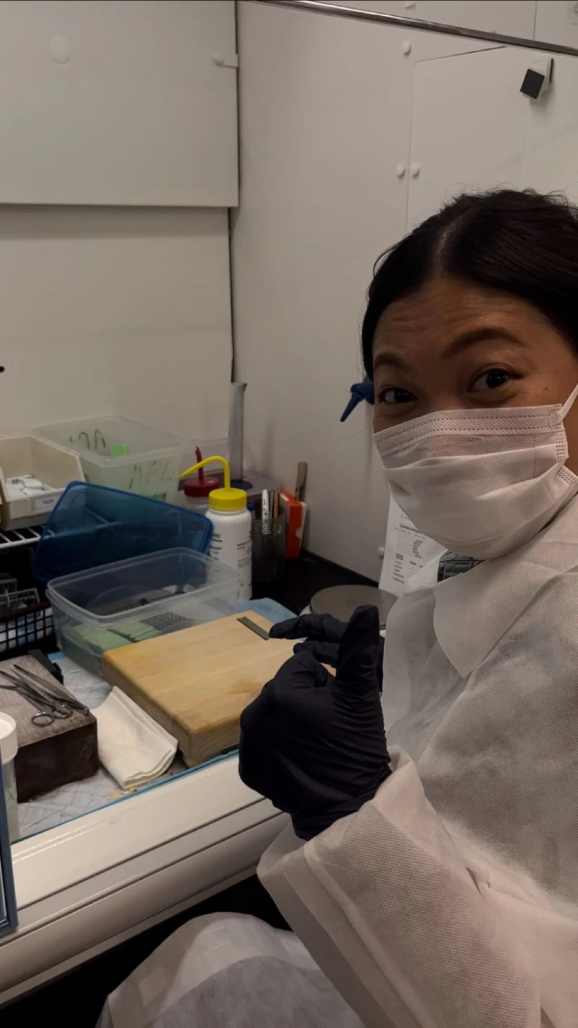 Dr. Magdalena Lenny Situmorang in front of fume hood