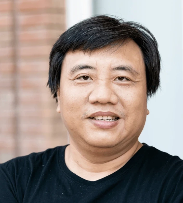 An image of Hung Mai wearing a black shirt